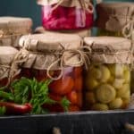 Pickled vegetables in glass jars.