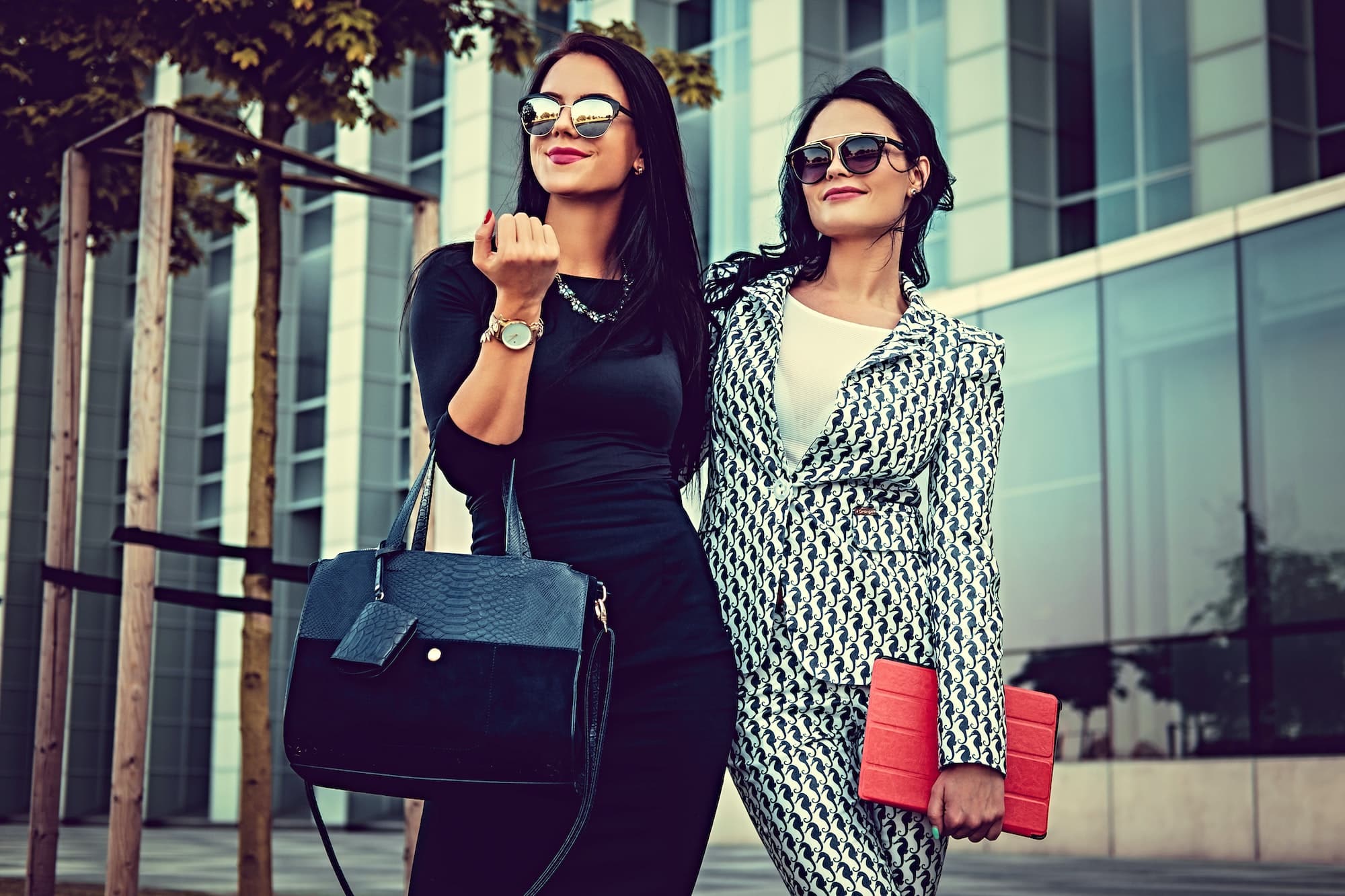 Portrait of two fashionable women on a street.