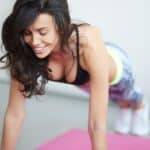 Push-ups fitness woman doing pushups inside