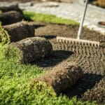 Lawn Care Contractor Prepares Area For Sod Installation.