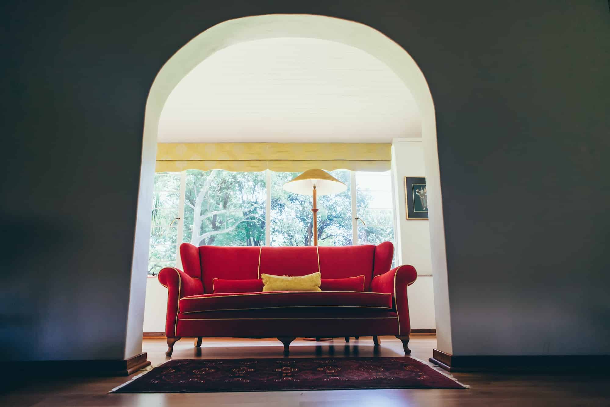 Red couch in home. Home decor