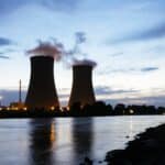 Germany, Lower Saxony, Grohnde, Grohnde Nuclear Power Plant along the Weser river during sunset