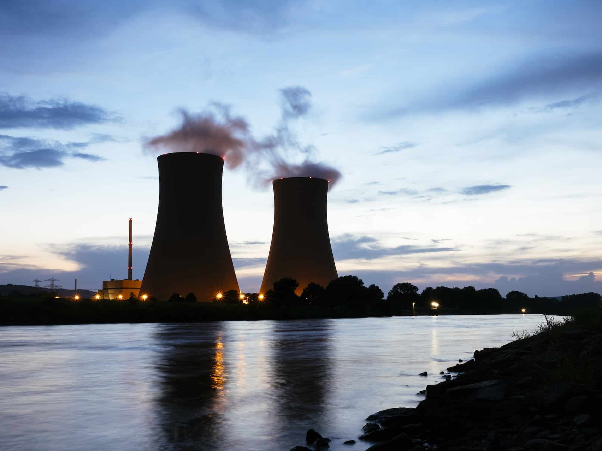 Germany, Lower Saxony, Grohnde, Grohnde Nuclear Power Plant along the Weser river during sunset